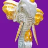 Escultura de Ganesha em Madeira de Bali - Destruidor de Obstáculos e Prosperidade:Uma peça verdadeiramente exclusiva, esculpida manualmente nas ilhas sagradas de Bali, Indonésia, para infundir o seu espaço com a energia ancestral da superação e do sucesso. Esta deslumbrante Cabeça de Ganesha não é apenas uma obra de arte; é um poderoso ativador esotérico imbuído da sabedoria e força do Divino. Artesanato Sagrado e Simbolismo Cromático: Artesanato Autêntico Balinês: Escultura Ganesha em madeira de Albásia, trabalhada com detalhe artesanal por mestres de Bali, garantindo uma peça única e de alta vibração.Significado das Cores: Dourado Vibrante: Simboliza a riqueza espiritual, a prosperidade e a iluminação.Cinzento Sóbrio: Evoca a estabilidade, a sabedoria e a matéria-prima da criação.Equilíbrio: Juntas, estas cores representam a harmonia essencial entre o material e o espiritual. Ganesha: O Destruidor de Obstáculos:Ganesha (ou Ganesh), o Deus com cabeça de elefante do panteão Hindu, é universalmente venerado como o Vigneshwara – O Destruidor de Obstáculos.Ao adquirir esta imagem sagrada, está a convocar para a sua vida os seguintes poderes: Sucesso e Novos Começos: Ganesha é a divindade invocada para iniciar projetos, empreendimentos ou qualquer nova jornada espiritual, garantindo um caminho auspicioso e livre de impedimentos. Força Pessoal: Invoca a coragem inabalável para romper com padrões antigos, avançar no caminho da evolução e enfrentar desafios com determinação. Prosperidade e Sabedoria: A sua presença atrai a abundância e a sabedoria divina.Coloque esta peça de decoração esotérica num local de destaque – no seu altar hindu, escritório ou na entrada de sua casa – e sinta o fluxo da energia desimpedida guiar os seus passos em direção à concretização dos seus objetivos e sonhos.Leve para casa a magia de Bali e o poder de Ganesha. Uma peça única para quem procura força, coragem e sucesso na vida.